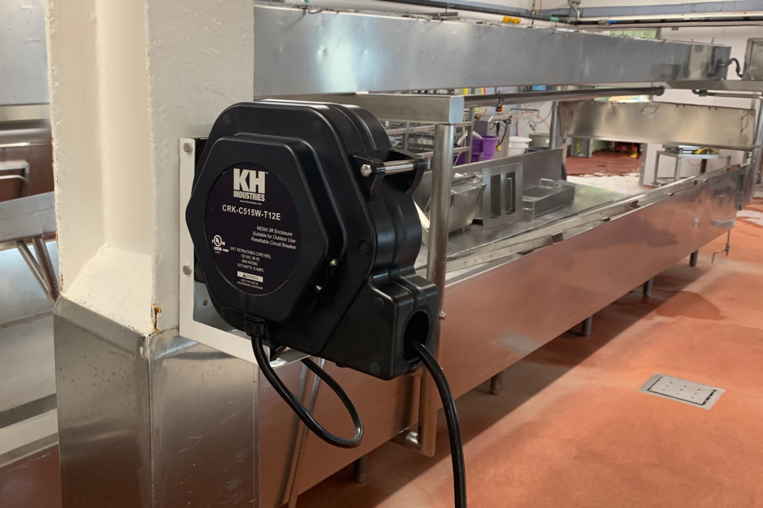 Commercial Kitchen Cord Reel Mounted In Professional Kitchen